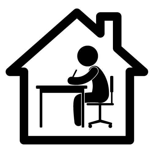 Image of a person at a desk in a house.